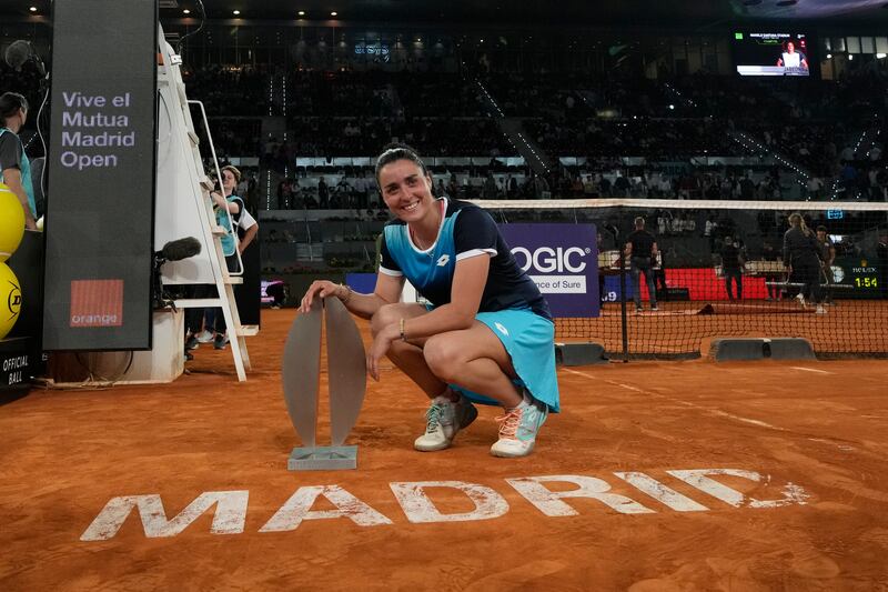 Ons Jabeur poses for photos with the Madrid Open trophy. AP