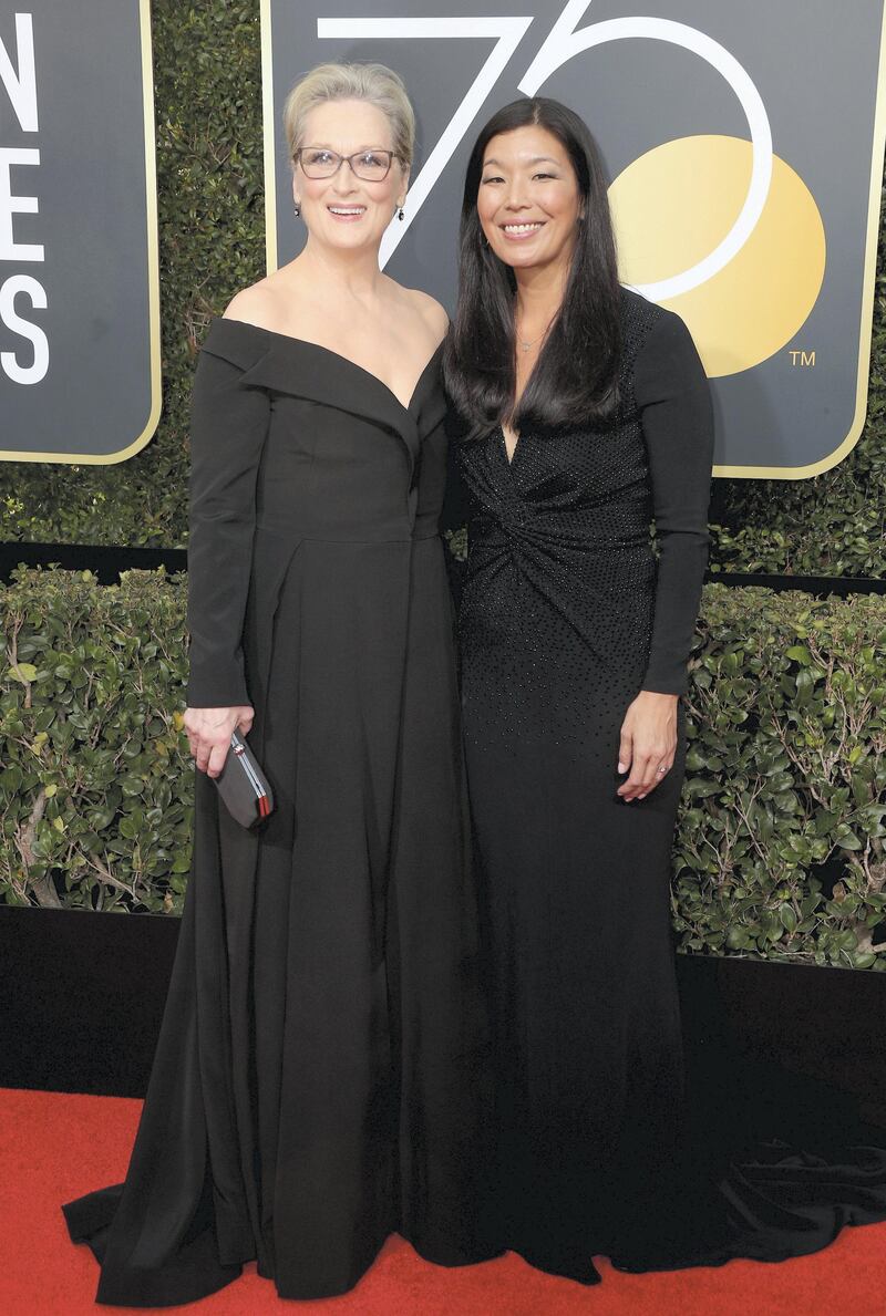 BEVERLY HILLS, CA - JANUARY 07:  Meryl Streep (L) and Ai-jen Poo attends The 75th Annual Golden Globe Awards at The Beverly Hilton Hotel on January 7, 2018 in Beverly Hills, California.  (Photo by Frederick M. Brown/Getty Images)
