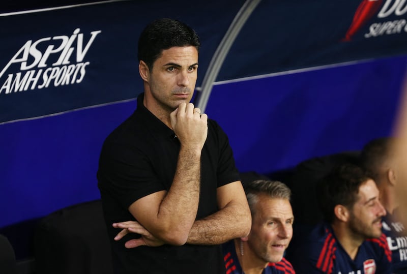 Arsenal manager Mikel Arteta watches from the dugout during the Dubai Super Cup match against Lyon at Al Maktoum Stadium in Dubai on December 8, 2022. Reuters