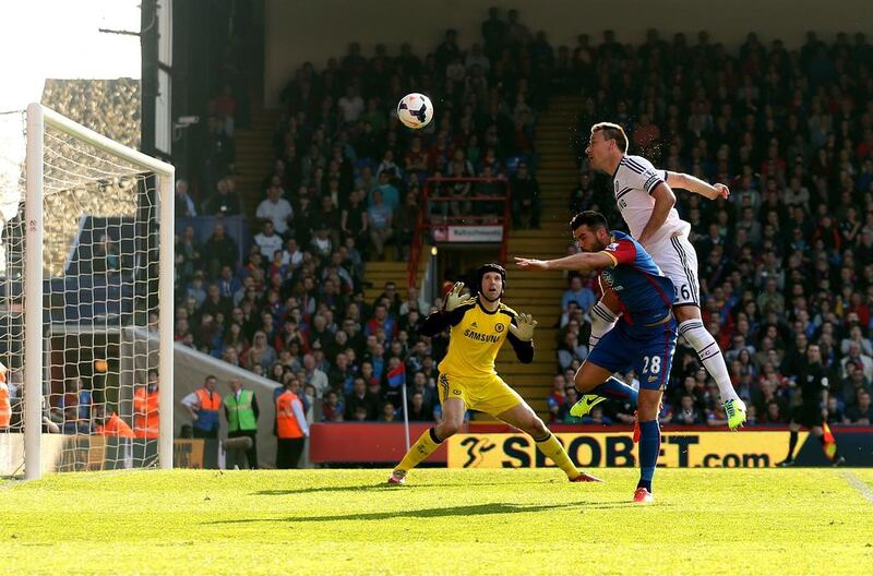 John Terry, right, of Chelsea is pressurised by Joe Ledley of Crystal Palace and heads the ball over his goalkeeperPetr Cech to open the scoring with an own goal during the Premier League match between Crystal Palace and Chelsea at Selhurst Park on March 29, 2014 in London, England. Scott Heavey/Getty Images