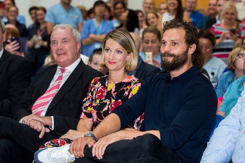 Northern Irish actor Jamie Dornan (right) with his sister Jessica Dornan Lynas and father Dr Jim Dornan, during the Pancreatic Cancer charity NIPanC launch at the Mater Hospital in Belfast. (Photo by Liam McBurney/PA Images via Getty Images)