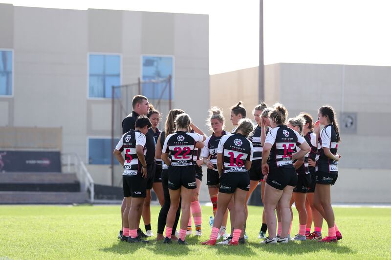 Dubai Falcons players huddle for a team talk with their coach during the game against Al Maha. Khushnum Bhandari / The National
