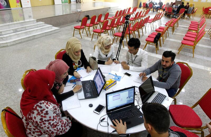 Iraqi youths work at The Station, Baghdad's incubator for would-be entrepreneurs. AFP