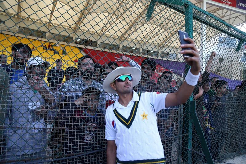 epa08087736 Pakistani Bowler Mohammad Abbas takes a selfie with fans after after winning on day fifth of the second Test Match between Sri Lanka and Pakistan at National stadium in Karachi, Pakistan, 23 December 2019. Pakistan beat Sri Lanka by 263 runs in the second Test.  EPA/REHAN KHAN