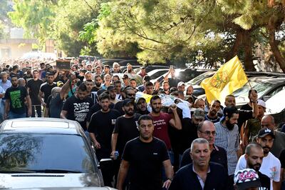 Palestinians carry the bodies of Fatah fighters who were killed during clashes with militants in Ain Al Hilweh. EPA