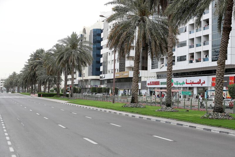 DUBAI, UNITED ARAB EMIRATES , April 11 – 2020 :- View of the empty road at the Al Muraqqabat area in Deira Dubai. Dubai is conducting 24 hours sterilisation programme across all areas and communities in the Emirate and told residents to stay at home. UAE government told residents to wear face mask and gloves all the times outside the home whether they are showing symptoms of Covid-19 or not. (Pawan Singh/The National) For News/Online/Instagram/Standalone