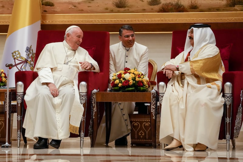 Pope Francis shares a lighter moment with Bahrain's King Hamad bin Isa Al Khalifa at the Sakhir Air Base, Bahrain.  Pope Francis's November 3-6 visit is part of his effort to pursue dialogue with the Muslim world. AP Photo
