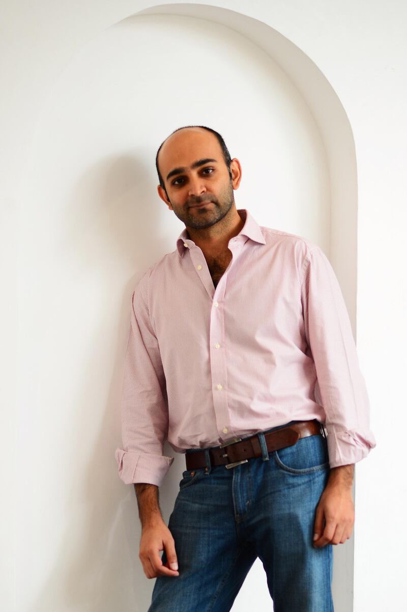 DOHA, QATAR - NOVEMBER 18:  Writer Mohsin Hamid of  "The Reluctant Fundamentalis" poses for a portrait during the 2012 Doha Tribeca Film Festival at AL Najada Hotel on November 18, 2012 in Doha, Qatar.  (Photo by Andrew H. Walker/Getty Images for Doha Film Institute)