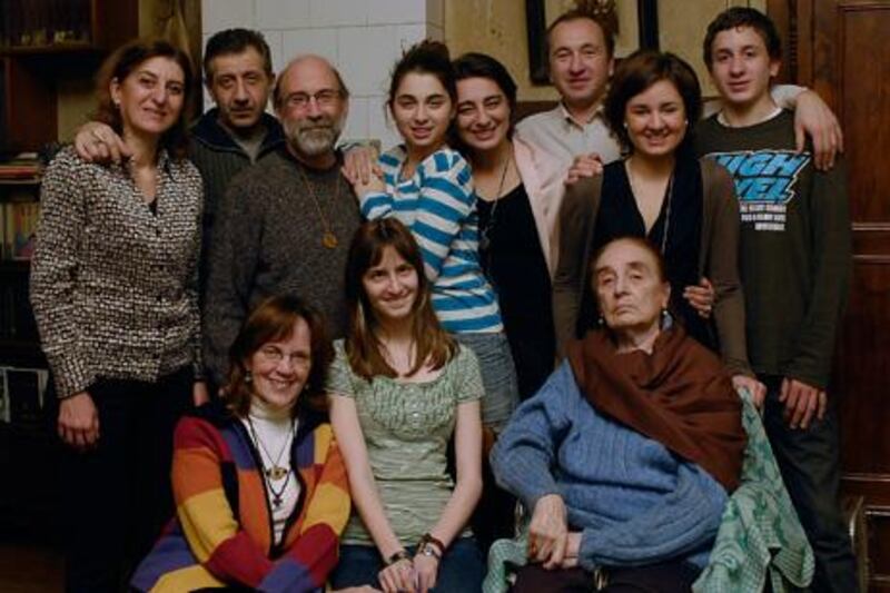 Two families become one: Denise Roig (seated left) and husband Ray Beauchemin (with beard), adopted Georgia (centre) in 1995. Her nurse was Olga Kartsivadze (seated). Other family members, standing from left: Tamar Kartsivadze, Lado Kuparadze, Liza Kuparadze, her mother Eka Kartsivadze, Eka's brother David, and his children (with Tamar) Sopiko and Sandro.