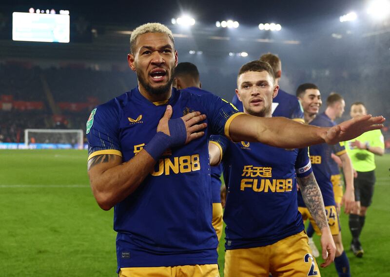 Newcastle United's Joelinton celebrates with Kieran Trippier after scoring in the 1-0 League Cup semi-final win against Southampton at St Mary's Stadium on January 24, 2023. Reuters