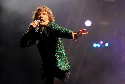 FILE - Mick Jagger of The Rolling Stones performs in Glastonbury, England on June 29, 2013. Jagger's jacket is among 55 L'Wren Scott creations going on sale this week at Christieâ€™s in London. (Photo by Jim Ross/Invision/AP, File)