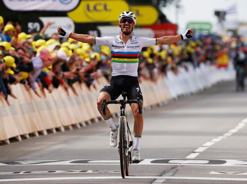 Deceuninck–Quick-Step rider Julian Alaphilippe celebrates as he crosses the finish line to win Stage 1 of the Tour de France on Saturday, June 26. Reuters