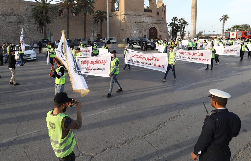 A group of young Libyan activists protest against the postponement of the presidential elections in Martyrs Square, Tripoli, on December 25, 2021. AFP