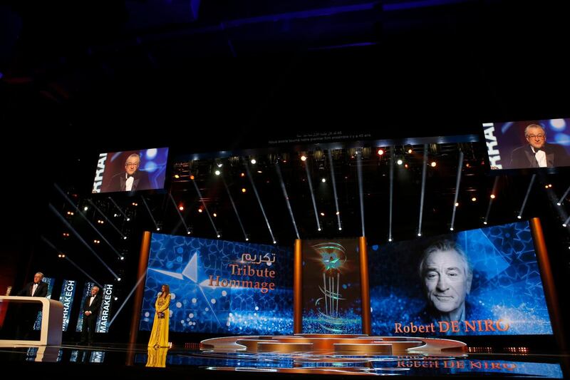 Robert De Niro, left, speaks after receiving a tribute from US director Martin Scorsese for his contribution to acting during the 17th Marrakech International Film Festival in Marrakech, Morocco. AP