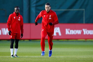 Liverpool's Virgil van Dijk with Sadio Mane during training in Melwood on Monday. Reuters