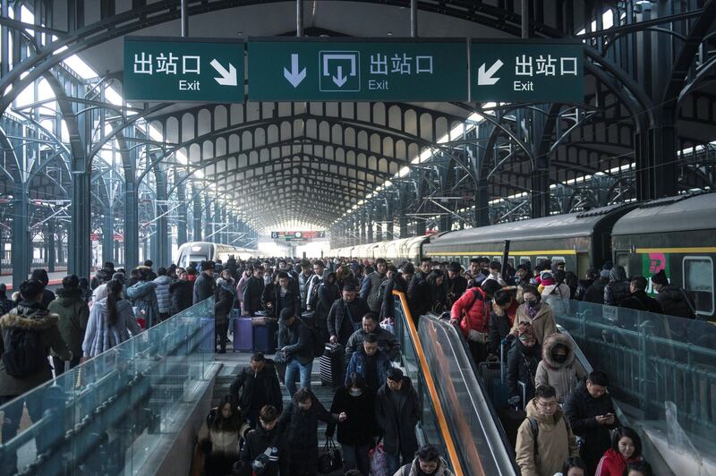 HARBIN, CHINA - JANUARY 21: Passengers make their way through Harbin Railway Station on January 21, 2019 in Harbin, China. About 2.99 billion trips are expected to be made during the 2019 Spring Festival travel rush between Jan 21 and March 1. The Spring Festival, or Chinese Lunar New Year, falls on Feb 5 this year. (Photo by Tao Zhang/Getty Images)