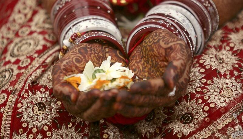 A Hindu bride in typical wedding garb. Reuters / Amit Dave