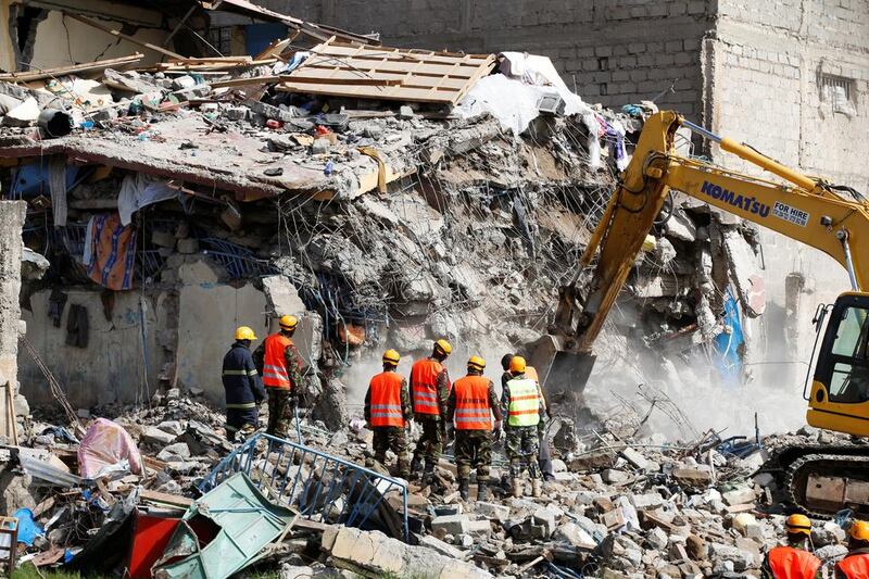 Emergency personnel work at the scene after a building collapsed in a residential area of Nairobi, Kenya. Baz Ratner / Reuters