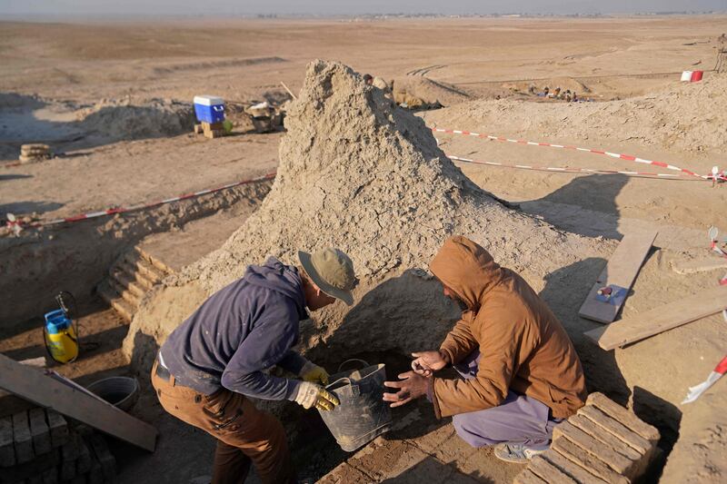 Members of a German-Iraqi archaeological expedition work on restoring the white temple of Anu in the Warka (ancient Uruk) site in Iraq's Muthanna prvoince.