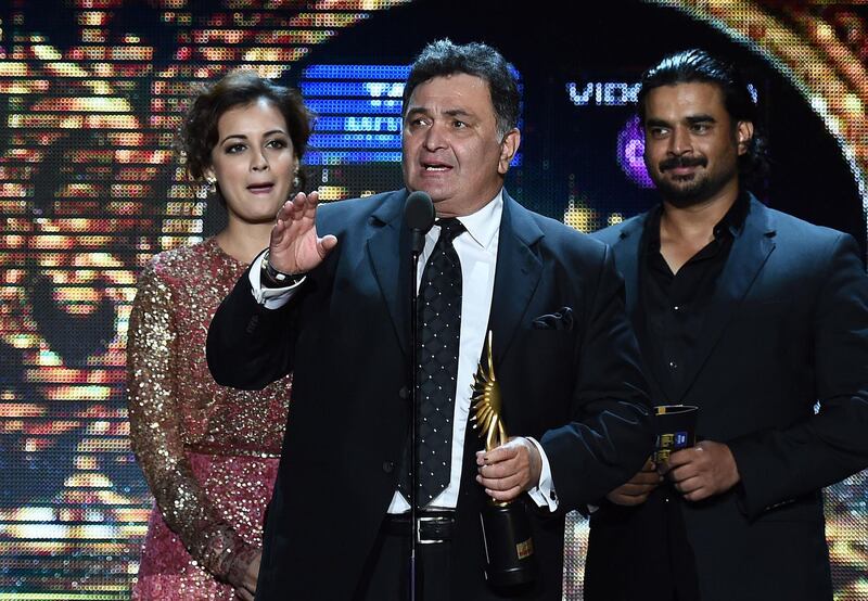 Rishi Kapoor receives the award for Best Performance in a Negative Role during the fourth and final day of the 15th International Indian Film Academy (IIFA) Awards in Tampa, Florida on April 27, 2014. AFP