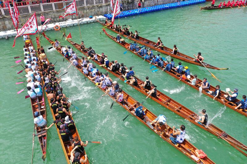 Rowers in their dragon boats at Tai O fishing village on Lantau Island in Hong Kong take part in races held to celebrate the Tuen Ng Festival. AFP