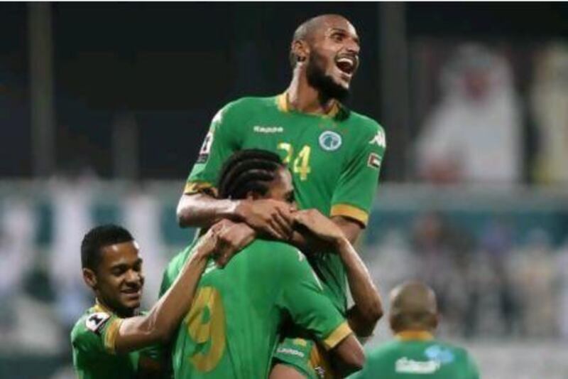 Essa Obaid, top, embraces Edgar Bruno  after the latter's third goal lifted Al Shabab over Ajman at Shabab's Maktoum Bin Rashid Al Maktoum Stadium in an Etisalat Cup match.