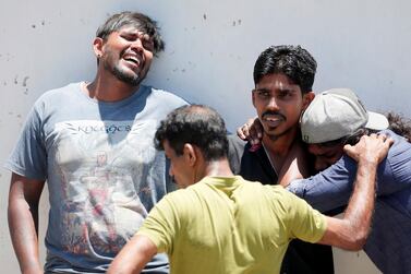 Relatives of a victim of an explosion at St. Anthony's Shrine, Kochchikade church in Colombo. REUTERS/Dinuka Liyanawatte