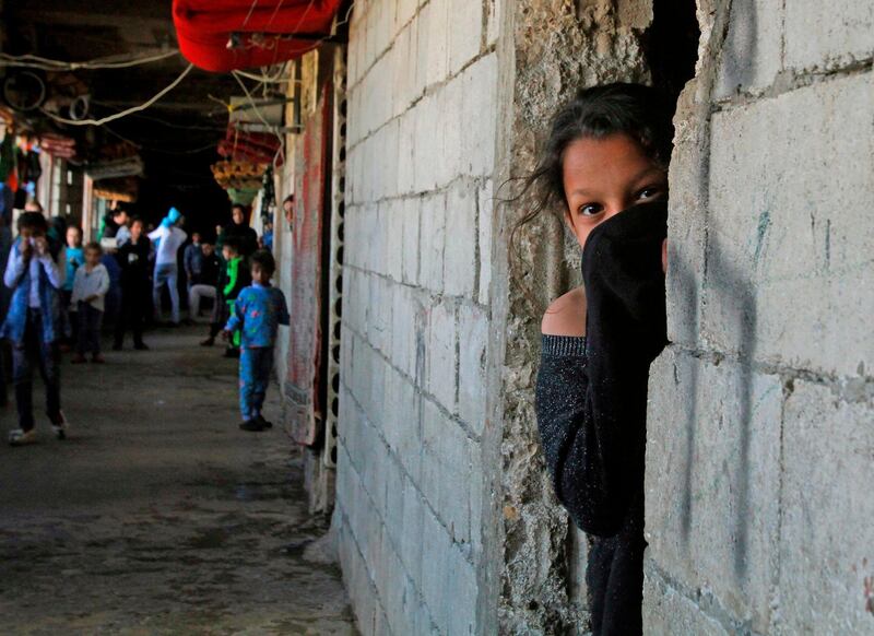 Syrian refugees in a construction site they have been using as a shelter in the southern Lebanese city of Sidon as Lebanon enters lockdown to protect against coronavirus outbreaks, on March 17, 2020. AFP