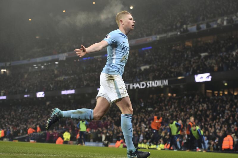 Manchester City's Belgian midfielder Kevin De Bruyne celebrates after scoring during the English Premier League football match between Manchester City and Tottenham Hotspur at the Etihad Stadium in Manchester, north west England, on December 16, 2017. / AFP PHOTO / PAUL ELLIS / RESTRICTED TO EDITORIAL USE. No use with unauthorized audio, video, data, fixture lists, club/league logos or 'live' services. Online in-match use limited to 75 images, no video emulation. No use in betting, games or single club/league/player publications.  / 