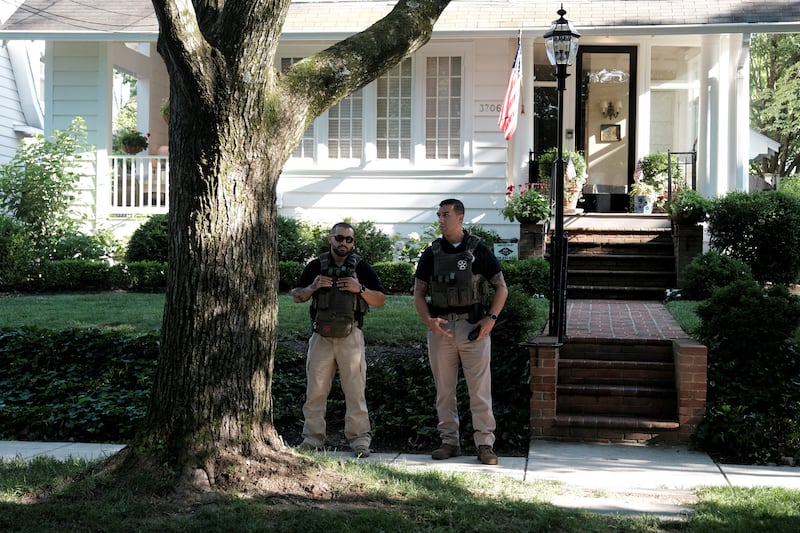 Police outside Mr Kavanaugh's home after the Supreme Court ended the federal right to abortion. Reuters 