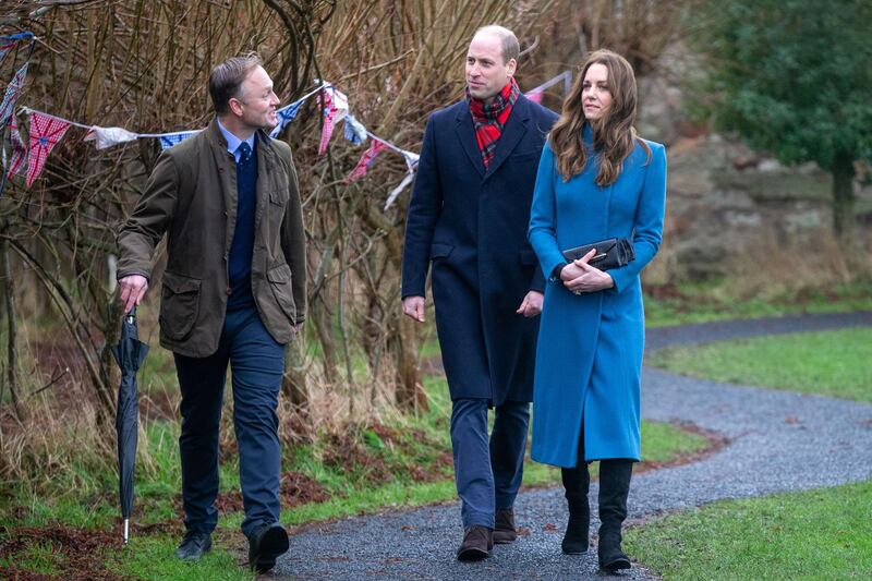 Prince William and Catherine, Duchess of Cambridge speak with the school head Nicholas Shaw during a visit to Holy Trinity Church of England First School. AFP