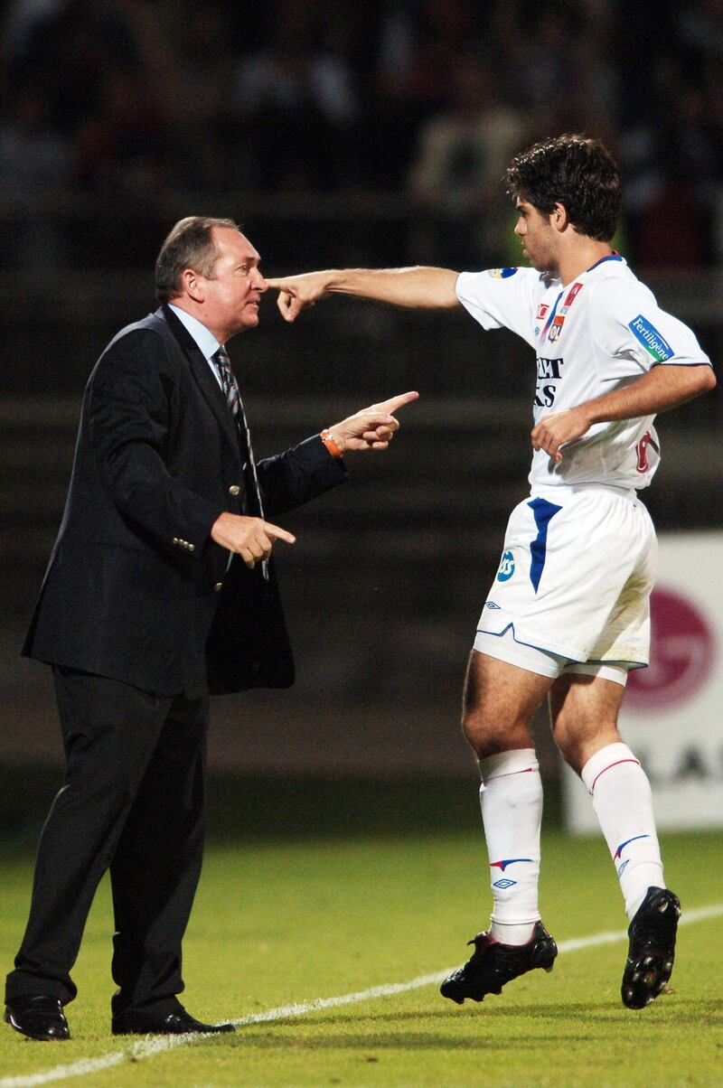In this file photo taken on October 16, 2005 Lyon's Brazilian midfielder Pernambucano Juninho celebrates with his coach French Gerard Houllier after he scoring during the French Ligue 1 match against Ajaccio at Gerland Stadium in Lyon. AFP