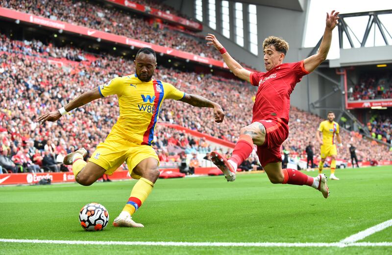 Crystal Palace's Jordan Ayew with Liverpool's Kostas Tsimikas at Anfield. Reuters