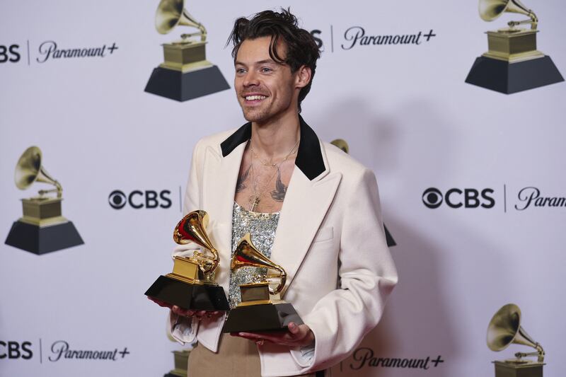 Harry Styles with his awards for Best Pop Vocal Album and Album of the Year for Harry's House. Reuters
