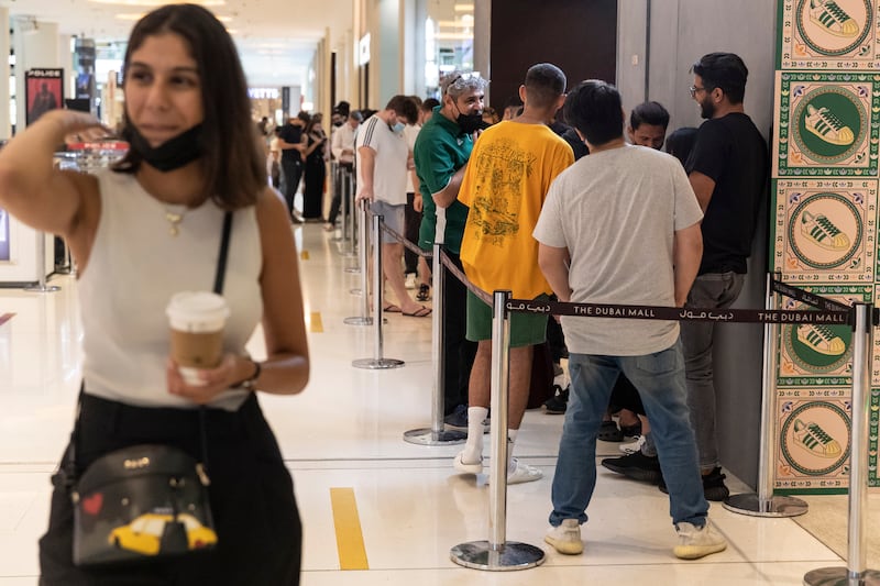 Queues build at the adidas store in The Dubai Mall. Antonie Robertson / The National
