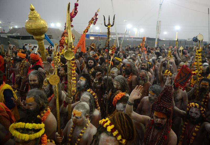 Indian naked sadhu (Hindu holy man) walk in a procession towards Sangam -- the confluence of the Ganges, Yamuna and mythical Saraswati rivers -- during the auspicious bathing day of 'Mauni Amavasya' at the Kumbh Mela in Allahabad on February 4, 2019. Millions of Hindu pilgrims took the plunge in holy rivers February 4, led by naked, ash-smeared holy men and accompanied by chants from Hindu holy texts on the most auspicious day of the Kumbh Mela festival.
 / AFP / SANJAY KANOJIA
