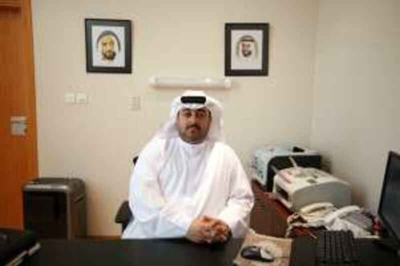 United Arab Emirates - Abu Dhabi - Nov. 30, 2008:
The United Arab Emirates National Rehabilitation Centre director general Dr. Hamad Al Ghaferi sits behind his desk at the facility located in Abu Dhabi on Sunday, Nov. 30, 2008. Amy Leang/The National  

 *** Local Caption ***  al_113008_rehab_02.JPGal_113008_rehab_02.JPG