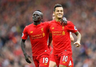 Philippe Coutinho, right, was an original member of Liverpool's attacking Fab Four, alongside Mane, left, Salah and Firmino 