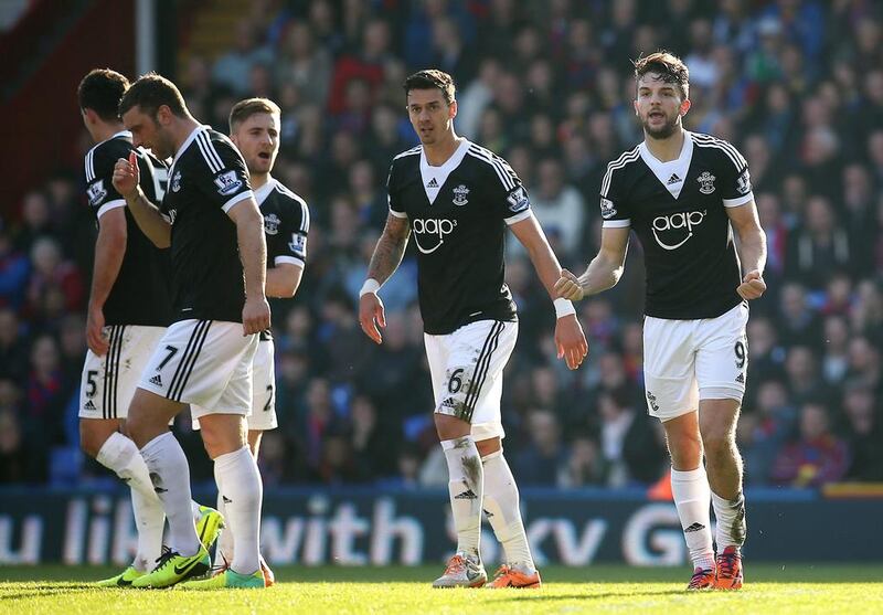 Jay Rodriguez of Southampton, right, celebrates with teammates after scoring the first goal of the game during the Barclays Premier League match between Crystal Palace and Southampton at Selhurst Park on March 08, 2014. Charlie Crowhurst / Getty Images