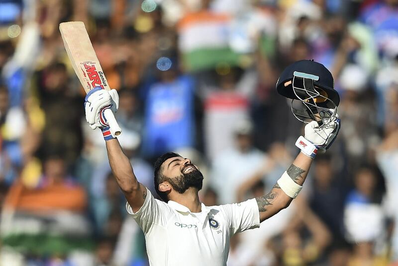 Indian cricket team captain Virat Kohli celebrates after scoring a double century (200 runs) on the third day of the second Test cricket match between India and Sri Lanka at the Vidarbha Cricket Association Stadium in Nagpur on November 26, 2017. (Photo by PUNIT PARANJPE / AFP) / ----IMAGE RESTRICTED TO EDITORIAL USE - STRICTLY NO COMMERCIAL USE----- / GETTYOUT