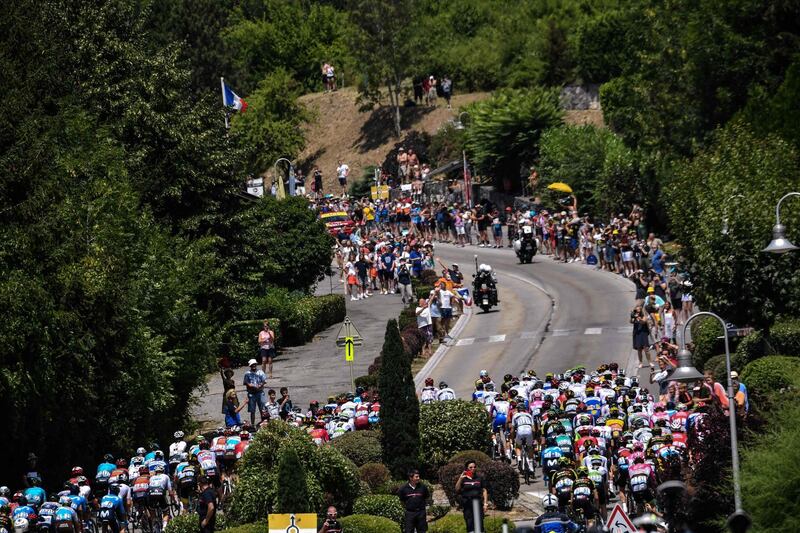 Cyclists ride during the 10th stage of the Tour de France between Annecy and Le Grand-Bornand. Jeff Pachoud / AFP