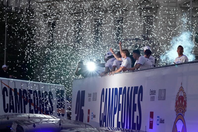 Luka Modric and his Real Madrid teammates celebrate during the open top bus trophy parade. AP