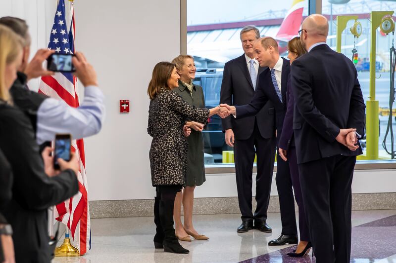 The royal couple are greeted by Lt Governor Karyn Polito, centre, Massachusetts Governor Charlie Baker, back, and first lady Lauren Baker, back left, as they arrive at Boston Logan International Airport. AP