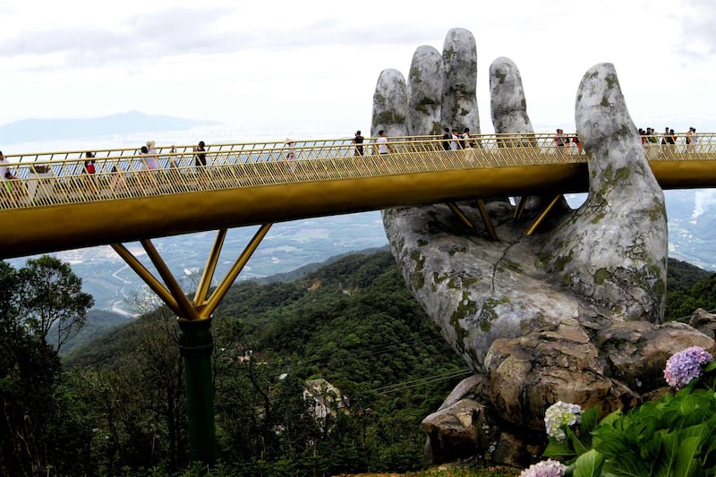 Visitors walk along the 150-metre bridge. AFP Photo