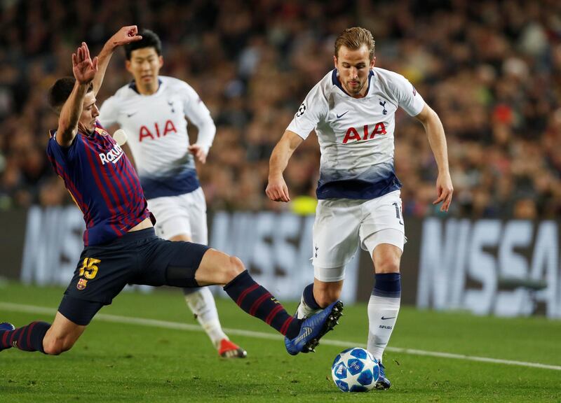 Tottenham's Harry Kane in action with Barcelona's Clement Lenglet. Reuters