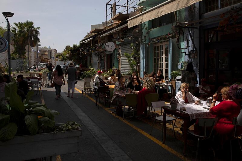 People sit in a restaurant in the Jaffa neighborhood of Tel Aviv, Israel. AP Photo