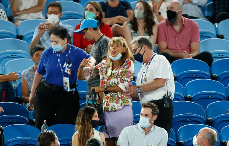 A spectator is escorted from Rod Laver Arena by security for shouting abuse at Rafael Nadal  during his win over Michael Mmoh. AP