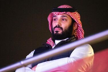 A handout picture provided by the Saudi Royal Palace shows Saudi Crown Prince Mohammed bin Salman attending the heavyweight boxing match between Andy Ruiz Jr. and Anthony Joshua for the IBF, WBA, WBO and IBO titles in Diriya, near the Saudi capital late on December 7, 2019. Joshua reclaimed his world heavyweight crown from Andy Ruiz, outclassing the Mexican-American to score a unanimous points victory. - RESTRICTED TO EDITORIAL USE - MANDATORY CREDIT "AFP PHOTO / SAUDI ROYAL PALACE / BANDAR AL-JALOUD" - NO MARKETING - NO ADVERTISING CAMPAIGNS - DISTRIBUTED AS A SERVICE TO CLIENTS / AFP / Saudi Royal Palace / Bandar AL-JALOUD / RESTRICTED TO EDITORIAL USE - MANDATORY CREDIT "AFP PHOTO / SAUDI ROYAL PALACE / BANDAR AL-JALOUD" - NO MARKETING - NO ADVERTISING CAMPAIGNS - DISTRIBUTED AS A SERVICE TO CLIENTS