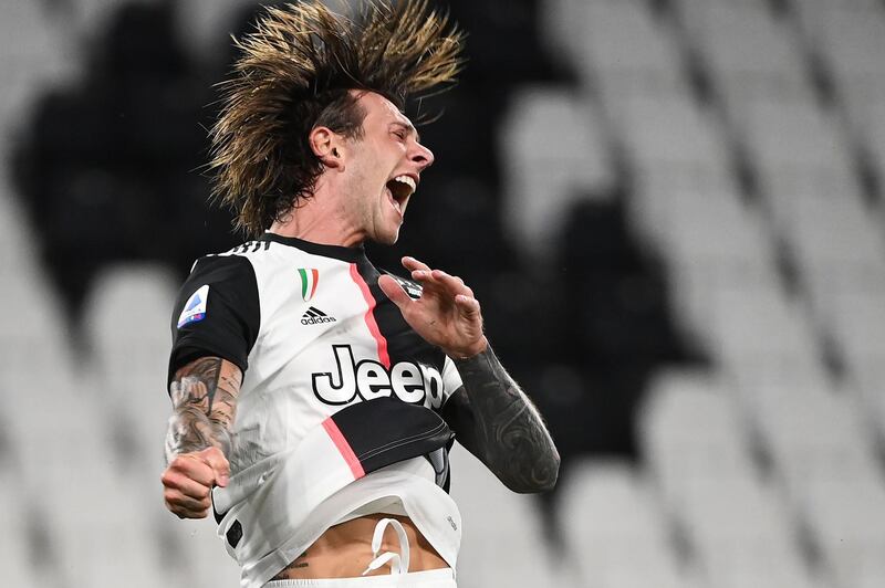 Juventus' midfielder Federico Bernardeschi celebrates after scoring during the Italian Serie A football match between Juventus and Sampdoria played behind closed doors at the Allianz Stadium in Turin.  AFP