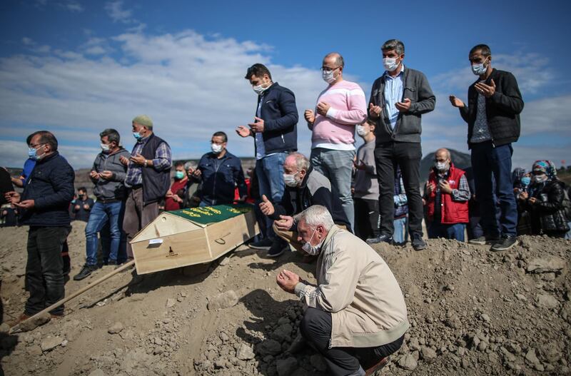 Relatives attend a funeral ceremony for Bayram Dogruya and Hatice Dogruya who were found dead under a collapsed building after a 7.0 magnitude earthquake in Izmir. EPA